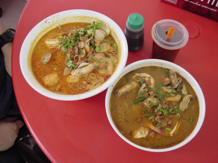 Curry seafood noodles (left) and tom yam seafood noodles (right)