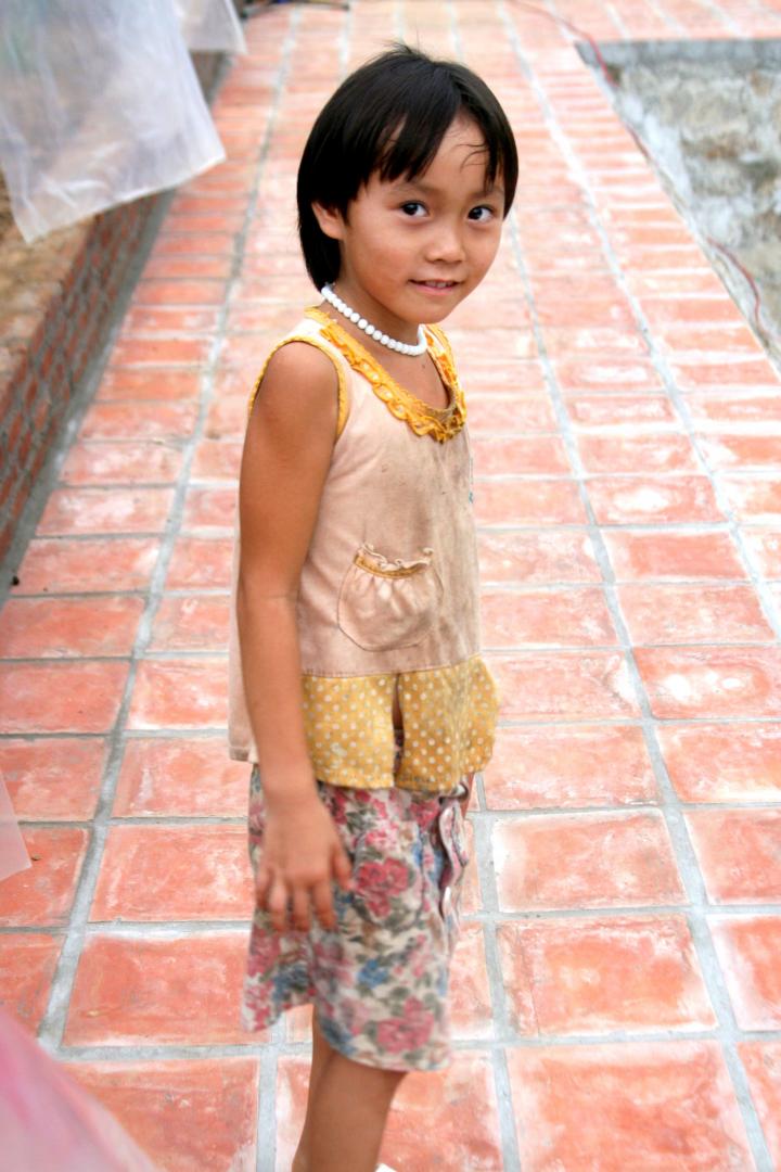 A girl from one of the neighboring farms was shy yet fascinated by all the strange guests.