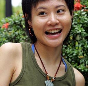 Singaporean Au Tak Lam, a 24-year-old computer engineer student, matches her swanky outfits with jade amulets, while colourful crystals adorn her nimble fingers.