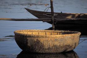 A small basket boat on the river at Hoi An.