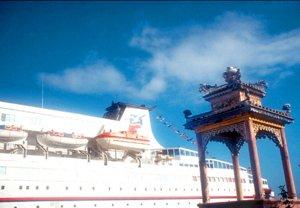 The Pearl in Danang, contrasted against an old temple erected to the Goddess of the Sea.