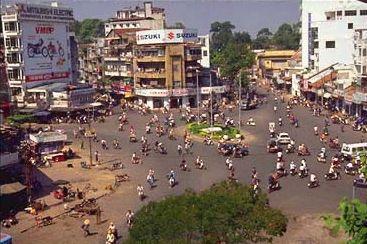 Day or night, Ho Chi Minh City is full of life. The swimming pool at the New World Hotel looks down on the swarm of bicyclists.