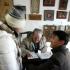 A young man and his girlfriend hover impatiently as an elderly man scribbles on a sheet of paper -- awaiting not a fortune, but a new name, at a licensed shop located near a Beijing Buddhist temple.<b