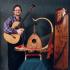 Musicologist Rick Heizman with some of his favorite musical instruments: In the center is a Burmese saung gauk, behind it is a Middle Eastern oud from Syria, on the right is a Chinese zheng.