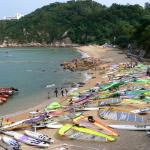 Taking a break - windsurfers on the beach, Cheung Chau island, Hong Kong.