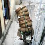 Riding with vegetable baskets from the market