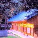 Sunrise gilds a pavilion at Naksansa Temple.