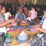 Women preparing special religious offerings for a wedding in Bali.
