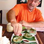 Trying sticky rice with dipping sauces in The Tamarind Restaurant in Luang Prabang.