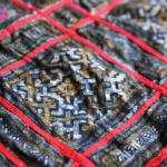 Tinted indigo batik on cotton. Note that some areas of the batik have been selectively tinted with a warm brown natural dye to give added dimension to the design.