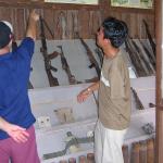 Khom shows us some of the munitions on display at his museum