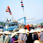 Waiting for the fishing boats to come in.