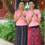 Smiling Thai guide welcome visitors to the Jim Thompson home in Bangkok