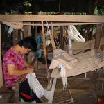 People weaving cotton