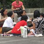 Maids gather near the Central MTR station in Hong Kong. 