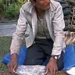 Nepali herder making breakfast chapatis along the Sali Khola, Nepal.