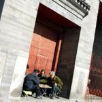 Beijing residents play chequers in a doorway in Hutong. Beijing's Hutongs date back to the 12th century and are a labyrinth of brick houses with walled courtyards.