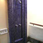 The "open" shower located in the privacy of the big and spacious bathroom. On the right you look right into the waters of the Straits of Malacca.