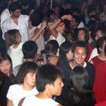 Foreign students party away a Friday night at Propaganda, a bar at Wudaokou in Beijing's university district 24 September 2004, where some 30,000 foreign students live and study. With more than 30,000 foreign students living and studying in Beijing, a part of the capital's Haidian university district has turned into a cosmopolitan party center where students from around the world gather against a distinctly Chinese backdrop.