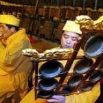 Chinese musicians perform at the Bell temple in Beijing, China, welcoming the New Year.