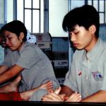 Masseurs and masseuses go to work on foot-sore foreigners.