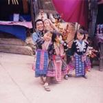 Some Hmong children dressed in their traditional to pose with tourists. Each pose costs 20 Baht.