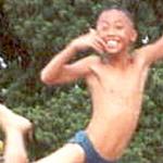 River Flight. A Lopburi schoolboy leaps for joy.