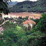 Luang Prabang, former capital of the Lao monarchy, basks beside the Mekong, seemingly secure in its bowl of mountains.