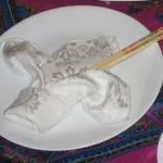 Note the homage to French influence in Vietnam with the Fleur de Lys napkin fold.