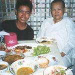 Dee and his grandmother in front of the dinner feast. Phnom Penh, Cambodia.