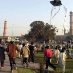 Pakistani children run to catch a kite during a kite flying festival, locally known as 'Basant', in the eastern city of Lahore, 09 February 2003, as officials said around 100,000 people from inside and outside the country had arrived in the city to celebrate the occasion. Two people died and more than 100 were injured during the annual kite flying festival marking the advent of spring in Pakistan. Public parks and rooftops were crowded with revellers celebrating the festival which started with music concerts and dinner parties organized privately or as public events late Saturday.