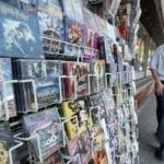 A Thai man walks past a VCD movie stall at a market in Bangkok.