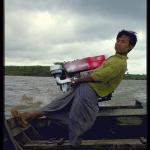 Under a threatening sky the ferryman struggled to turn the boat towards Swar Ywarma.