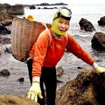 Kotoyo Motohashi, 68, Japan's legendary 'Ama' woman shellfish diver, smiles at a sea shore in Shirahama city, 100km southeast of Tokyo. Motohashi has been diving without tanks since the age of 18.