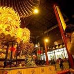 A woman prays before a Buddhist statue during New Year's celebrations at Longhua Temple in Shanghai, China. The Chinese celebrate New Year by ringing a bell, burning incense, and praying at a temple, to bring good luck and happiness.