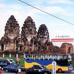 Holding guard over this Khmer-style temple in Lopburi, "city of monkeys", are scores of the vigilant monkeys, who watch the train as it passes.