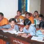 Novice monks and village kids in a Banan English class.