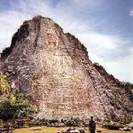 The largest Buddha image in the world, Buddha Mountain is a cliff face inlaid with gold leaf in the outline of a sitting, Sukhothai-era Buddha. It is 130 meters tall, 70 meters wide, and can be seen from miles away. (Note the diminutive soldier below).