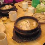 Ginseng chicken soup. The small clear glass on the left of the chicken soup is ginseng wine, which I poured into the soup.