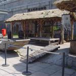 Notice the string of chili hanging above the doorway. Symbolizes a baby boy has been born to the family.