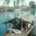 Fishing boat on a tranquil backwater of the Saigon River.