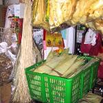 Bundles of dried banana bark (hanging left) and bamboo leaves.