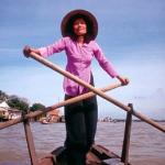 A woman in Can Tho rows across the Can Tho River which flows into the Hau Giang or Lower River, one of two main branches of the Mekong that run through Vietnam after the river splits in Cambodia. Can Tho is considered the political, economic, transportation and cultural center of the Mekong Delta.