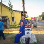 Taking a break from the long drive. A French road marker (found all along Highway One) alongside the road to Danang.
