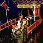 Flags are hoisted to signal the start of the show - springing up from beneath the water's surface; they somehow emerge completely dry.