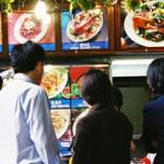 Eating: a very serious business in Singapore. Hungry customers at the Lau Pa Sat Festival Market, Singapore.