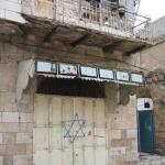 Star of David spray painted on an Arab shop, next to a mosque in Hebron, Israel.