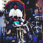 Pedicab driver, ever vigilant for customers on the bustling streets of Thamel.