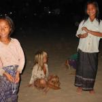 The little girl with blonde hair's father is most likely a westerner, according to the people in town.