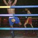 This is no unipedal acknowledgment of victory: the fight hasn't even started yet. Both men are engaged in the ram muay, the pre-fight workout and exorcism dance.